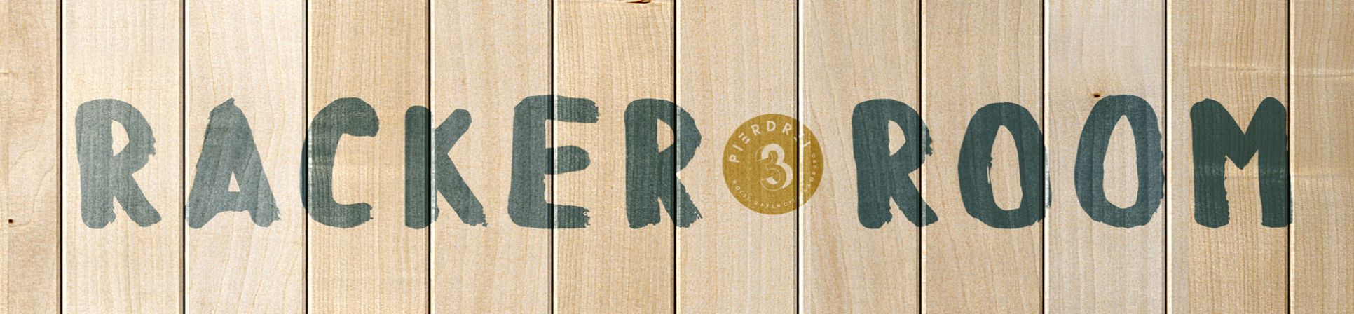 Logo of the RACKER ROOM at PIERDREI painted on a wooden wall 