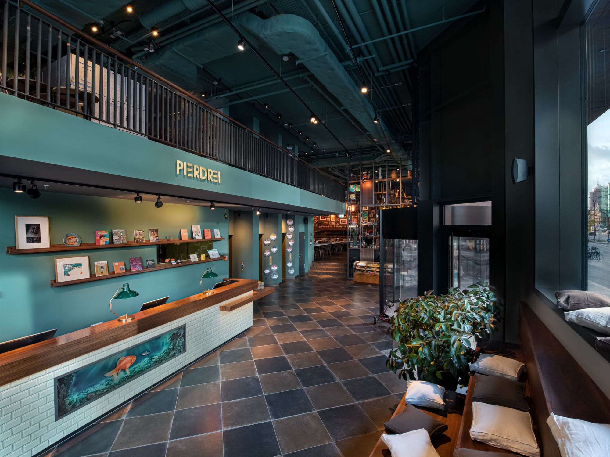 Entrance area PIERDREI Hotel HafenCity Hamburg and hotel lobby with reception desk
