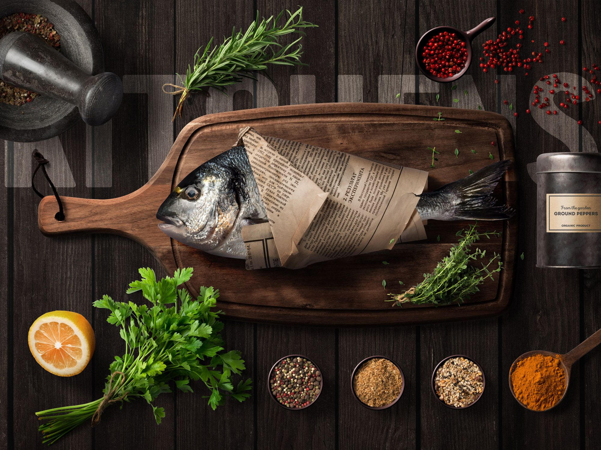 fish wrapped in newspaper on wooden board surrounded by herbs and spices at HafenCity restaurant